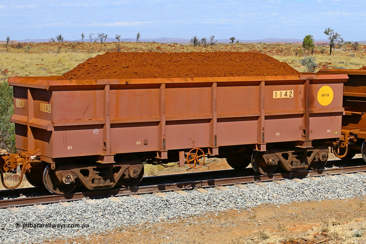 1142 170729 0222
Robe River ore waggon 1142, built by Bradken Rail Qld in April 2012, fixed coupler handbrake side loaded view at the 103 km, between Maitland Siding and the Fortescue River on the Deepdale line. July 29, 2017.
Keywords: 1142;Bradken-Rail-Qld;Robe-ore-waggon;