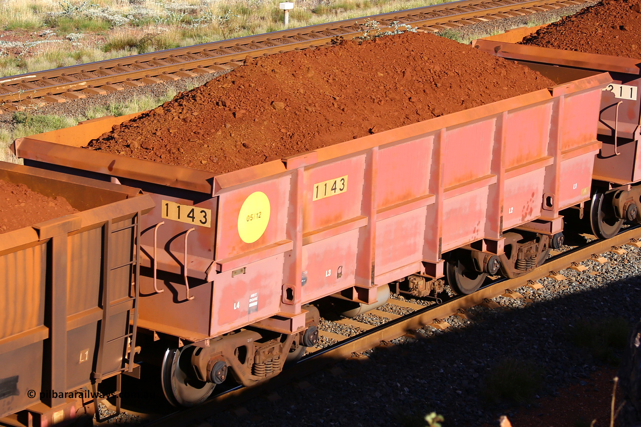 1143 210322 9736
Robe River ore waggon 1143, built by Bradken Rail Qld in May 2012, rotary coupler end non-handbrake side loaded view, at the 17 km on the Cape Lambert line, March 22, 2021.
Keywords: 1143;Bradken-Rail-Qld;Robe-ore-waggon;
