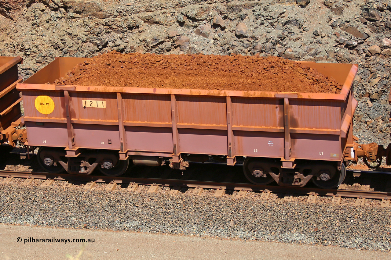 1211 160306 1644
Robe River ore waggon 1211, built by Bradken Rail Qld in May 2012, fixed coupler non-handbrake side loaded view, at the 45 km, Harding Siding on the Cape Lambert line. March 6, 2016.
Keywords: 1211;Bradken-Rail-Qld;Robe-ore-waggon;