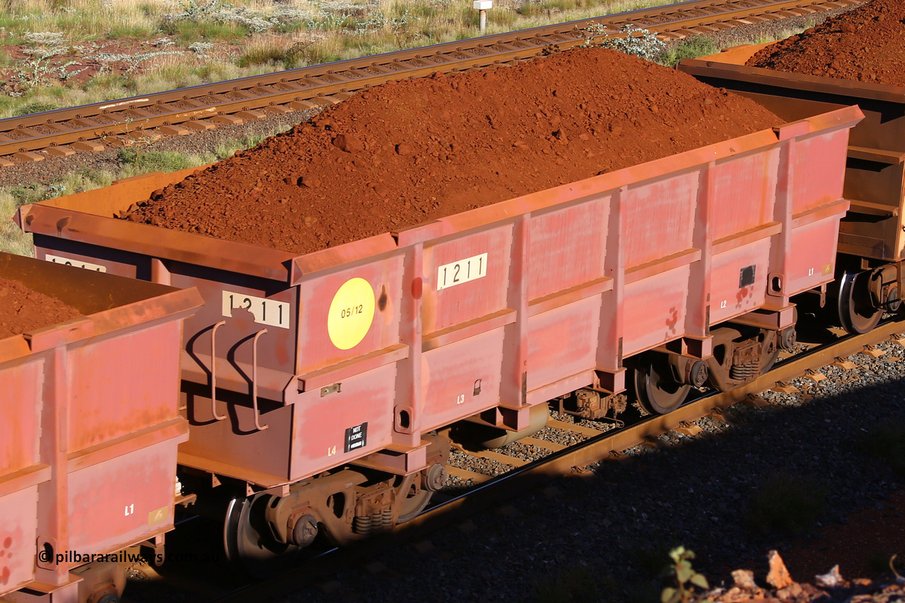 1211 210322 9737
Robe River ore waggon 1211, built by Bradken Rail Qld in May 2012, rotary coupler end non-handbrake side loaded view, at the 17 km on the Cape Lambert line, March 22, 2021.
Keywords: 1211;Bradken-Rail-Qld;Robe-ore-waggon;