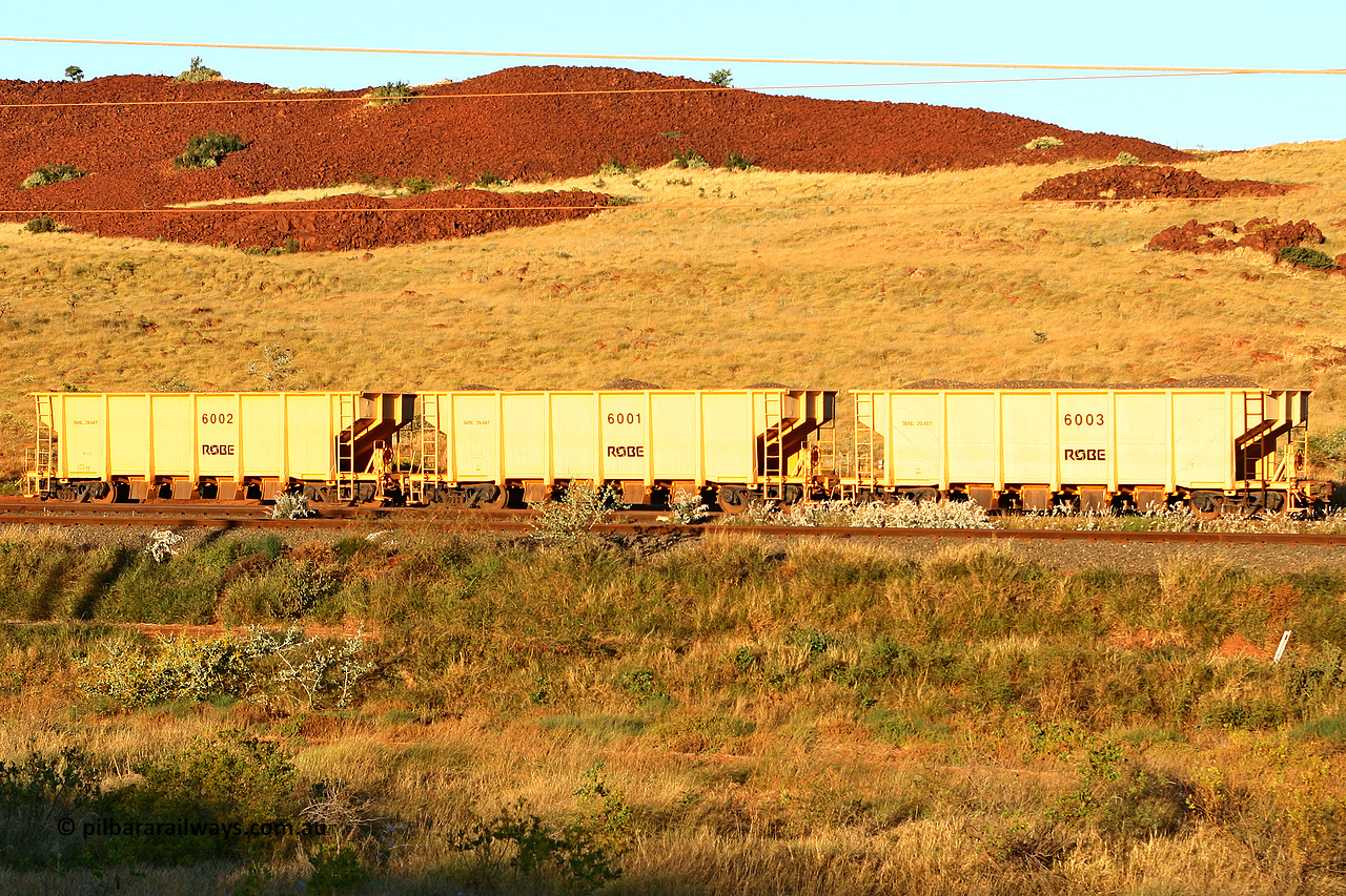 6001 060722 7638
Robe River ballast waggons. Robe had three built by Tomlinson Steel WA and numbered 6001 to 6003 as seen here in Cape Lambert yard. 1701 hours, July 22, 2006.
Keywords: 6001;Tomlinson-Steel-WA;Robe-ballast-waggon;
