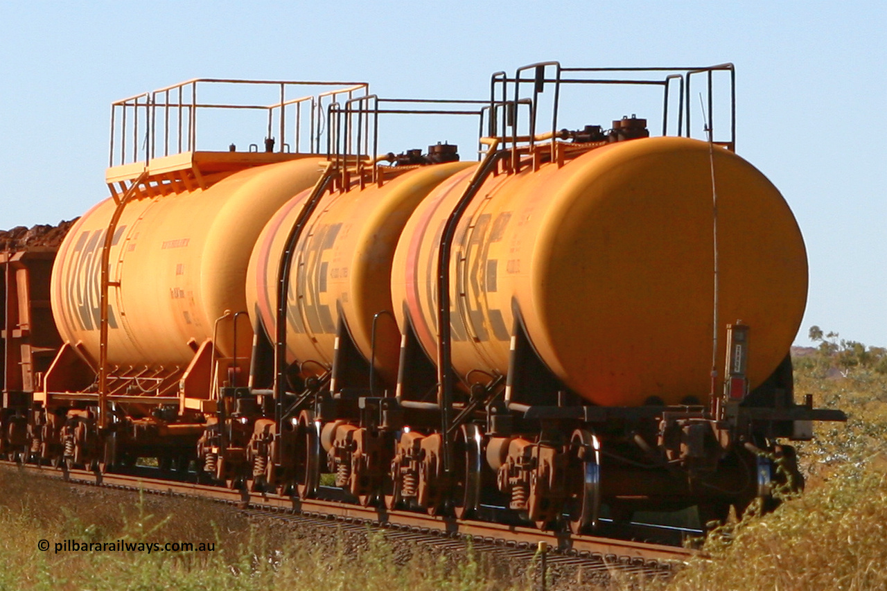 8001 060716 7203
Western Creek end of train view, Robe River diesel fuel tank waggon 8001 running empty on a loaded ore train, built by Comeng NSW in September 1972 with a 45,000 litre capacity. 1401 hours, July 16, 2006.
Keywords: 8001;Comeng-NSW;Robe-tank-waggon;