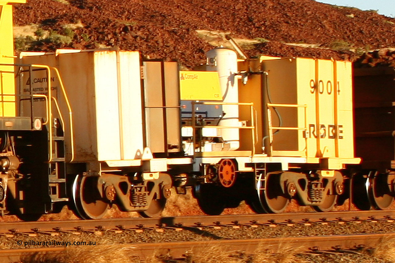 9004 060722 7639
Robe River compressor waggon 9004, a modified Nippon Sharyo Nihon built waggon with a Compair compressor, grey fuel tank and white air receiver. This style of compressor setup differs greatly from the original compressor waggons built by Nippon Sharyo Nihon. Cape Lambert yard July 22, 2006.
Keywords: 9004;robe-compressor-waggon;