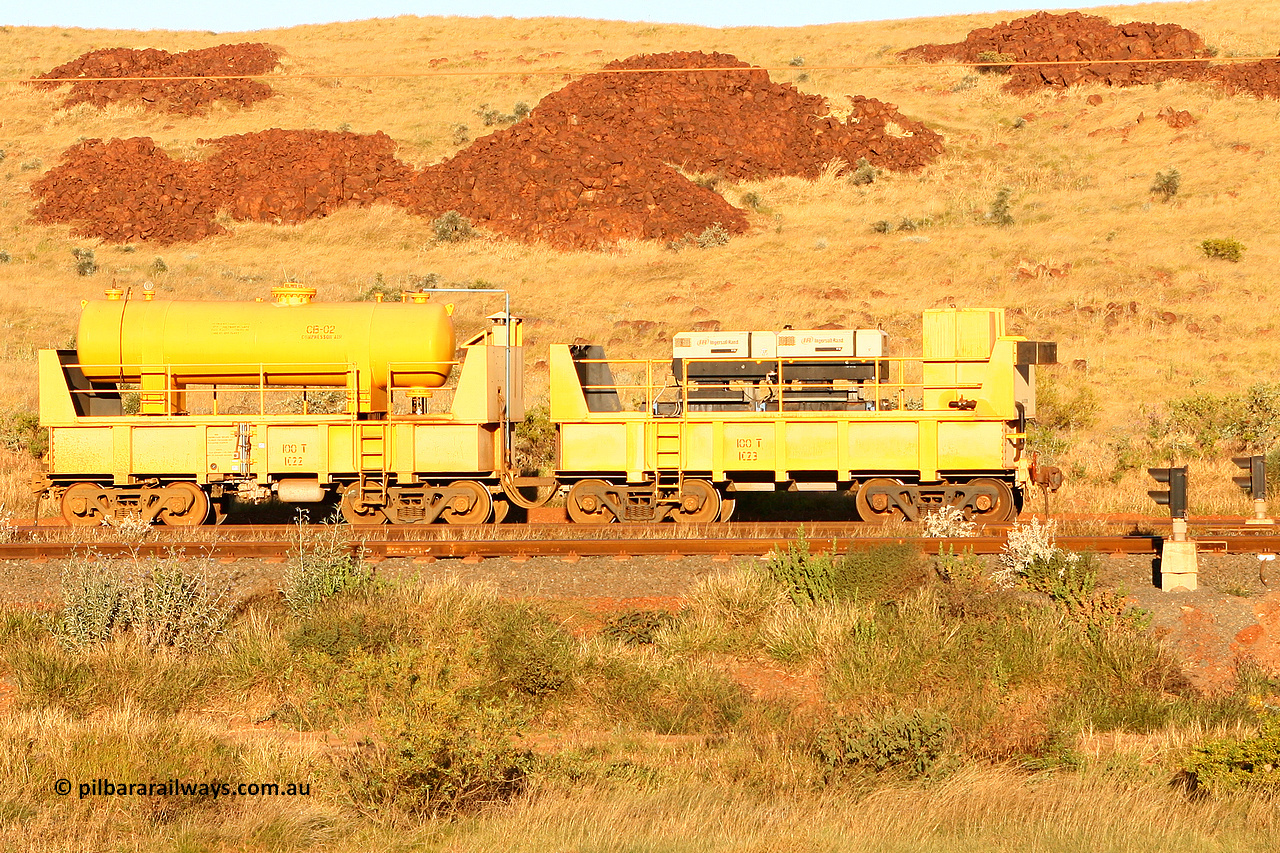 IC22 060722 7637
Robe River compressor waggon set IC 22 with air receiver and IC 23 with two Ingersoll Rand air compressors. These waggons are ballasted to 100 tonnes each and are modified ore waggons and used on the pooled fleet rakes that come from HIY [Yandicoogina] and West Angelas mines. Cape Lambert, July 22, 2006.
Keywords: IC22;robe-compressor-waggon;
