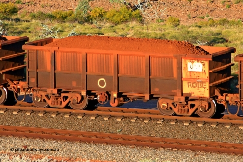 0051 110602 1706
Robe River ore waggon 051, built by Nippon Sharyo Nihon, rotary coupler end handbrake side loaded view at the 71 km, Western Creek on the Deepdale line. June 2, 2011.
Keywords: 051;Nippon-Sharyo-Nihon;Robe-ore-waggon;