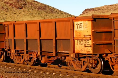 0119 060722 7591
Robe River ore waggon 119, built by Nippon Sharyo Nihon, rotary coupler end handbrake side empty view at the 11.7 km, Cape Lambert. July 22, 2006.
Keywords: 119;Nippon-Sharyo-Nihon;Robe-ore-waggon;