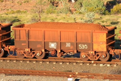 0530 110602 1604
Robe River ore waggon 530, built by Tomlinson Steel WA, rotary coupler end handbrake side loaded view at the 71 km, Western Creek on the Deepdale line. June 2, 2011.
Keywords: 530;Tomlinson-Steel-WA;Robe-ore-waggon;