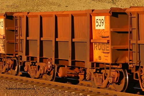 0539 060722 7608
Robe River ore waggon 539, built by Tomlinson Steel WA, rotary coupler end handbrake side empty view, at the 11.7 km, Cape Lambert. July 22, 2006.
Keywords: 539;Tomlinson-Steel-WA;Robe-ore-waggon;
