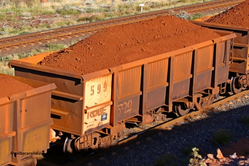 0599 210322 9716
Robe River ore waggon 599, built by Tomlinson Steel WA, rotary coupler end non-handbrake side loaded view at the 17 km on the Cape Lambert line, March 22, 2021.
Keywords: 599;Tomlinson-Steel-WA;Robe-ore-waggon;