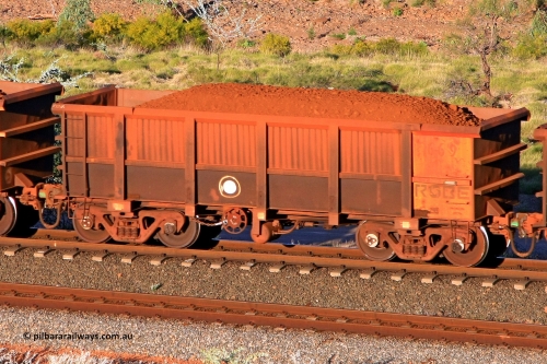 0669 110602 1722
Robe River ore waggon 669, built by Tomlinson Steel WA, rotary coupler end handbrake side loaded view at the 71 km, Western Creek on the Deepdale line. June 2, 2011.
Keywords: 669;Tomlinson-Steel-WA;Robe-ore-waggon;