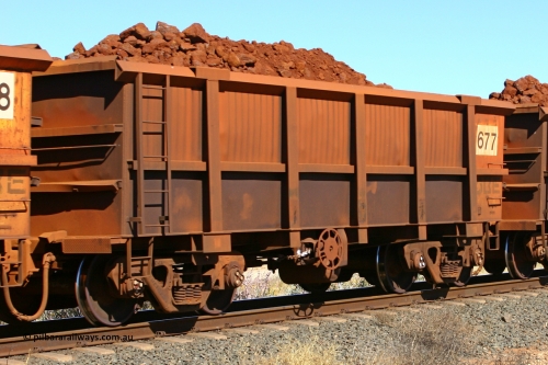 0677 060716 7185
Robe River ore waggon 677, built by Tomlinson Steel WA, fixed coupler end handbrake side loaded view at the 71 km on the Deepdale line, Western Creek, July 16, 2006.
Keywords: 677;Tomlinson-Steel-WA;Robe-ore-waggon;