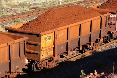 0698 210322 9681
Robe River ore waggon 698, built by Tomlinson Steel WA, rotary coupler end non-handbrake side loaded view at the 17 km on the Cape Lambert line, March 22, 2021.
Keywords: 698;Tomlinson-Steel-WA;Robe-ore-waggon;