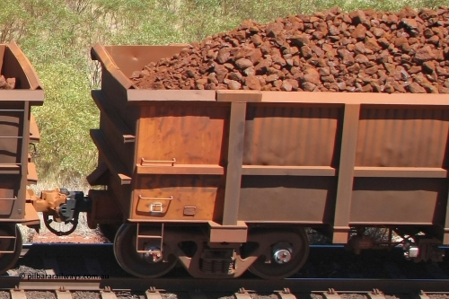 0719 081209 0110
Robe River ore waggon 719, built by Tomlinson Steel WA, rotary coupler end non-handbrake side panel and plate, loaded view at the 7 km location just south of Cape Lambert yard. December 9, 2008.
Keywords: 719;Tomlinson-Steel-WA;Robe-ore-waggon;