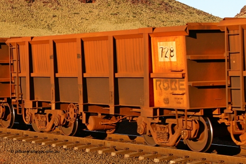 0728 060722 7587
Robe River ore waggon 728, built by Tomlinson Steel WA, rotary coupler end handbrake side empty partial view, at the 11.7 km, Cape Lambert. July 22, 2006.
Keywords: 728;Tomlinson-Steel-WA;Robe-ore-waggon;