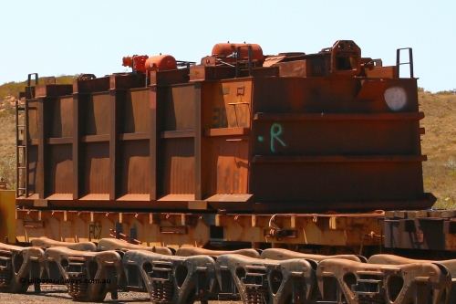 0928 070909 0667
Robe River ore waggon 928, built by Centurion Industries WA, rotary coupler end non-handbrake side upside down on flat waggon FC7, Cape Lambert. September 9, 2007.
Keywords: 928;Centurion-Industries-WA;Robe-ore-waggon;