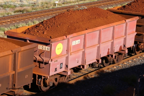1066 210322 9793
Robe River ore waggon 1066, built by Bradken Rail Qld in March 2012, rotary coupler end non-handbrake side loaded view, at the 17 km on the Cape Lambert line, March 22, 2021.
Keywords: 1066;Bradken-Rail-Qld;Robe-ore-waggon;