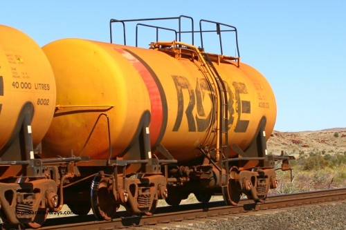 8001 060716 7201
Robe River diesel fuel tank waggon 8001 running empty on the rear of a loaded ore train, built by Comeng NSW in September 1972 with a 45,000 litre capacity, at the 71 km on the Deepdale line, Western Creek, July 16, 2006.
Keywords: 8001;Comeng-NSW;Robe-tank-waggon;