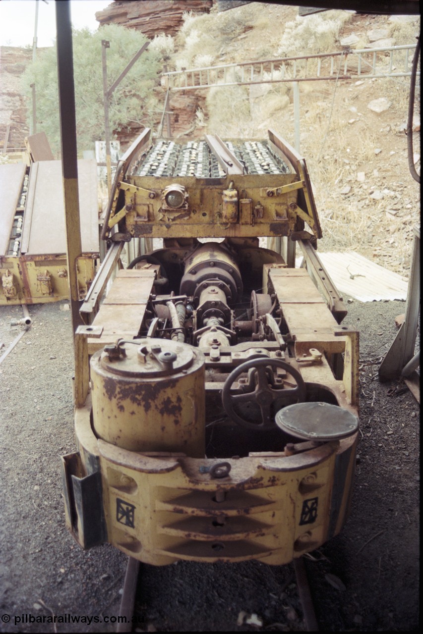 194-21
Wittenoom Gorge, Colonial Mine, asbestos mining remains, view of Mancha hauler with battery module open on ramp, view of driver's seat, controller, brake wheel and the drive motor inside the locomotive.
