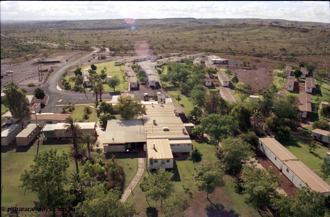 194-28
Yandi campsite for Henry Walker operated iron ore mine owned and managed by BHP, view of camp are from man cage on Kato 50 tonne hydraulic crane.
