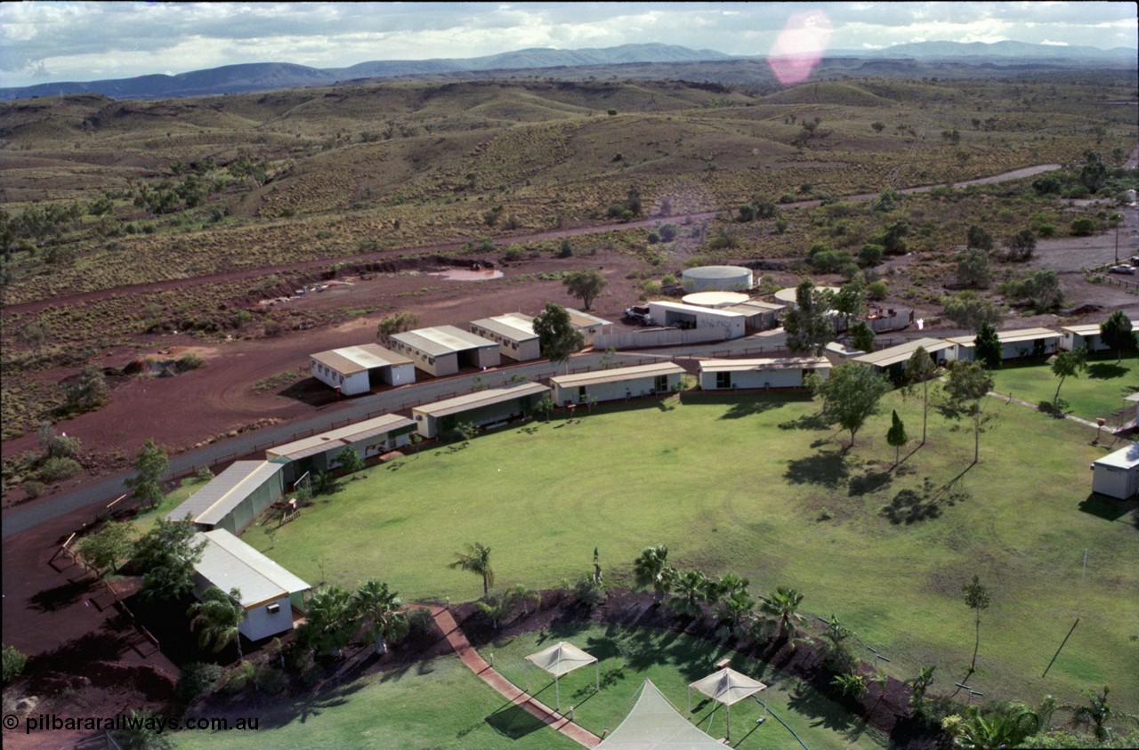 194-31
Yandi campsite for Henry Walker operated iron ore mine owned and managed by BHP, view of camp are from man cage on Kato 50 tonne hydraulic crane.
