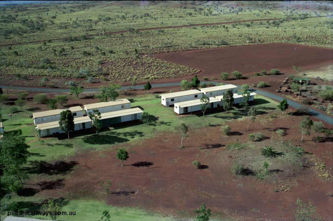 194-36
Yandi campsite for Henry Walker operated iron ore mine owned and managed by BHP, view of camp are from man cage on Kato 50 tonne hydraulic crane.
