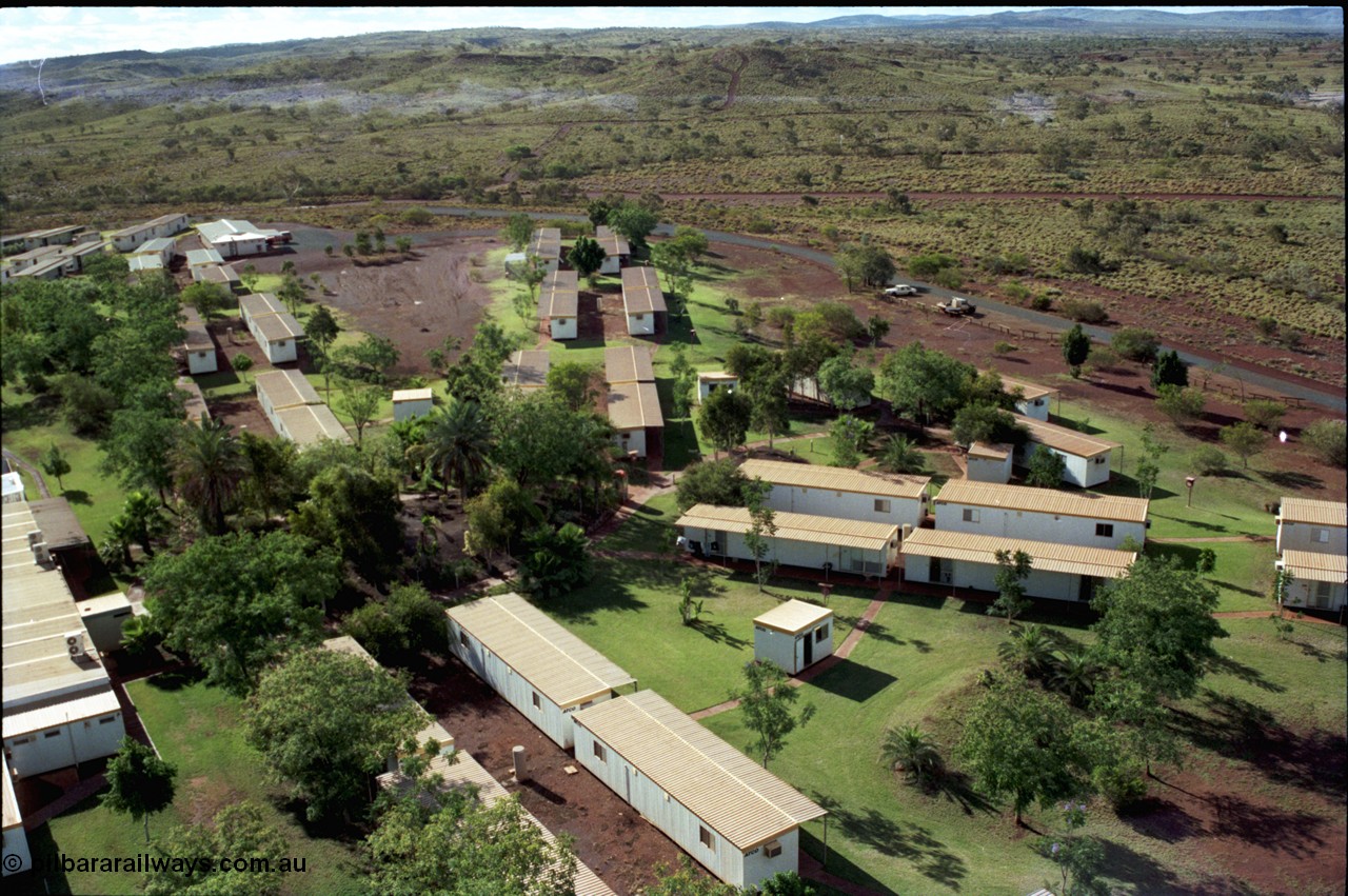 194-37
Yandi campsite for Henry Walker operated iron ore mine owned and managed by BHP, view of camp are from man cage on Kato 50 tonne hydraulic crane.
