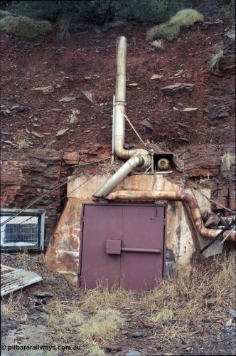 194-08
Wittenoom Gorge, Colonial Mine, asbestos mining remains, sealed up main mine adit or entry point, safety statistic board on the left, this was one of the main drives for the Colonial Mine. A couple of historical images can be seen here: [url=http://purl.slwa.wa.gov.au/slwa_b4232624_9]SLWA image b4232624_9[/url] and here: [url=http://purl.slwa.wa.gov.au/slwa_b1923178_1]SLWA image b1923178_1[/url].
