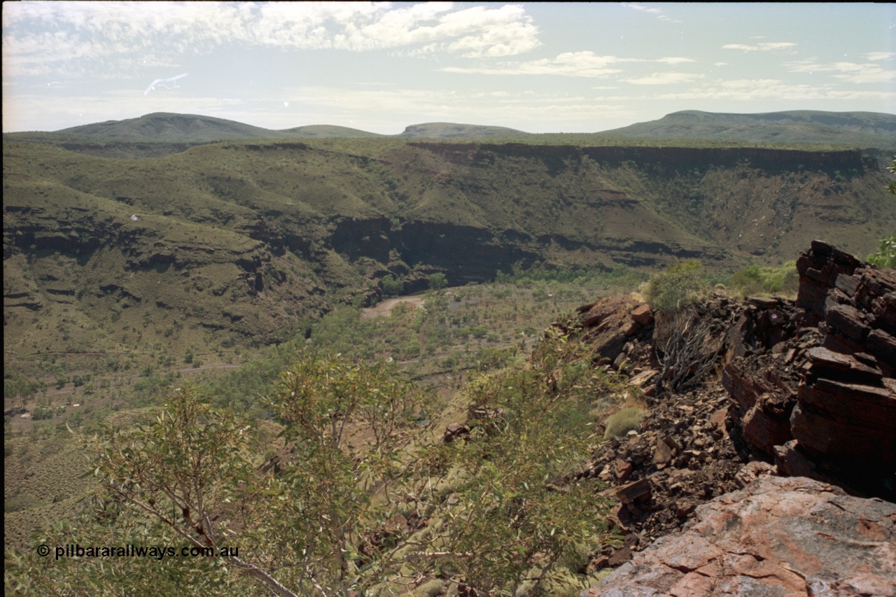 195-18
Wittenoom Gorge, view looking south down the gorge, the Colonial Mine is on the right and not visible behind the rock. The former market garden area can be just seen at the bottom left of image as Bolitho Rd cuts through the middle.
