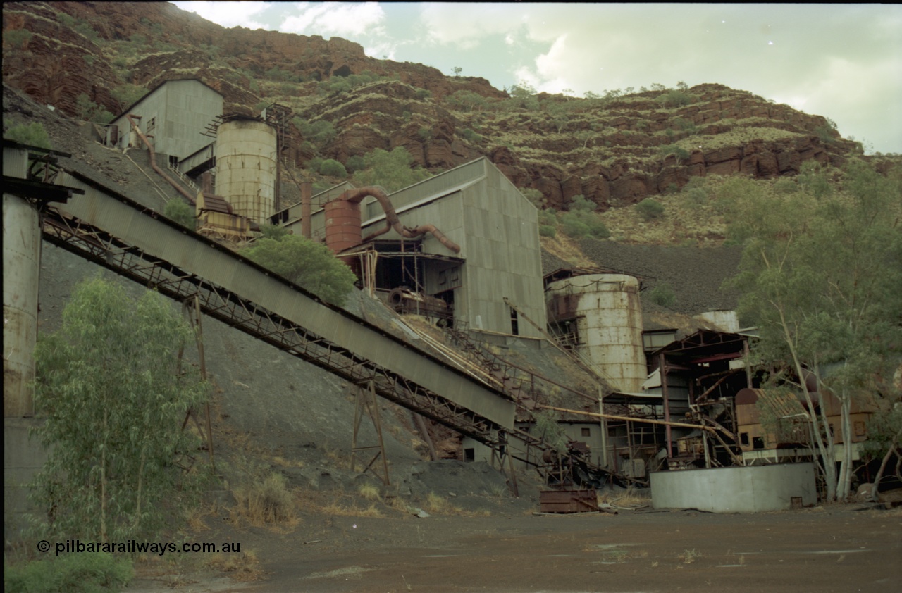 195-27
Wittenoom Gorge, Australian Blue Asbestos or ABA Colonial Mill, view looking up past the drier level with the crusher building at the top.
