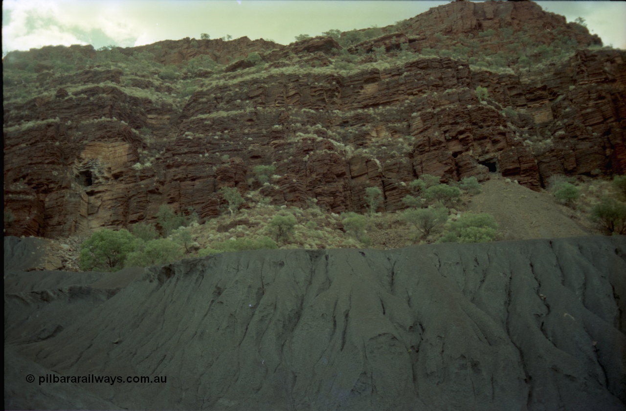 195-29
Wittenoom Gorge, Australian Blue Asbestos or ABA Colonial Mill, view of mine adits above the tailings in the west wall of the gorge.
