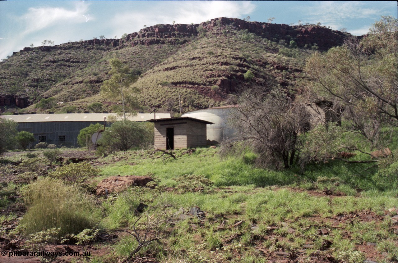 196-26
Wittenoom Gorge, view of power station generating hall with pump house and diesel storage tanks.
