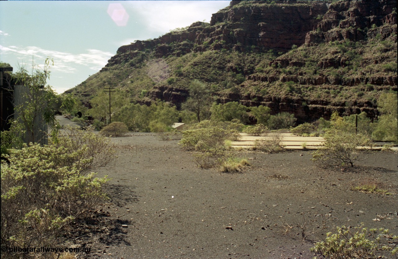 196-28
Wittenoom Gorge, Gorge Mine area, asbestos mining remains, view looking north east from remains of railways and mill towards power station, concrete pad is former workshops.
