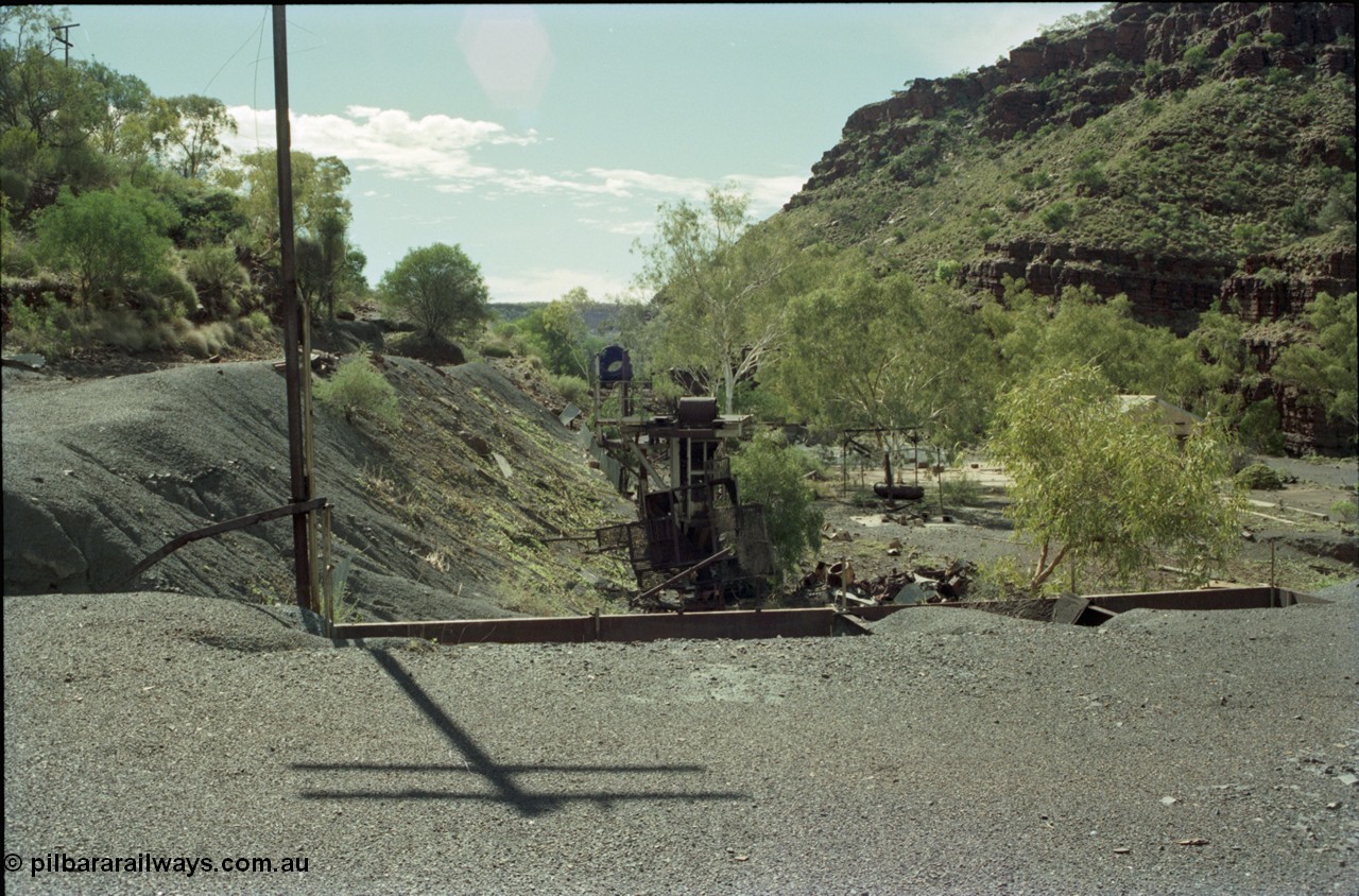 196-31
Wittenoom Gorge, Gorge Mine area, asbestos mining remains, view of the remains of the demolished buildings which formed the mill here, looking north east towards the power station.
