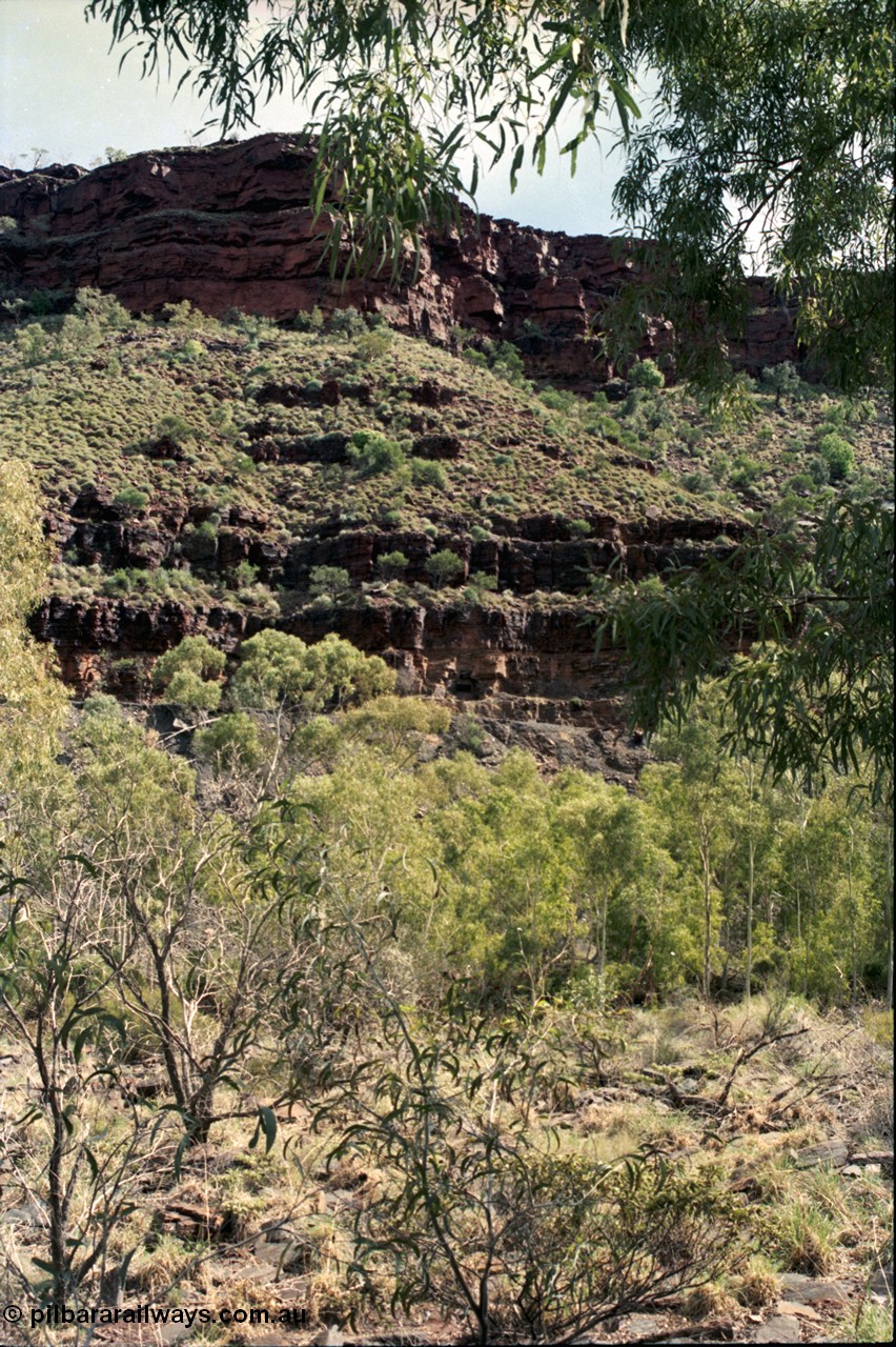 196-34
Wittenoom Gorge, Gorge Mine area, view of mine adits or entry points of drives going into the side of the gorge western side of Wittenoom Gorge.
