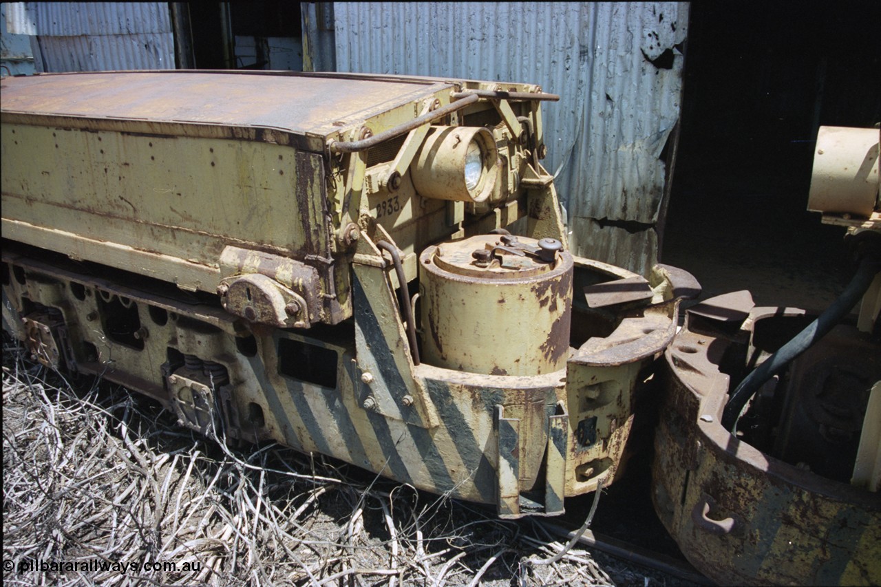 197-34
Wittenoom, Colonial Mine, view of the drivers 'cab' of a Mancha locomotive, view of drivers seat, brake wheel, controller and battery module with the number 2933 on it.
Keywords: Mancha;