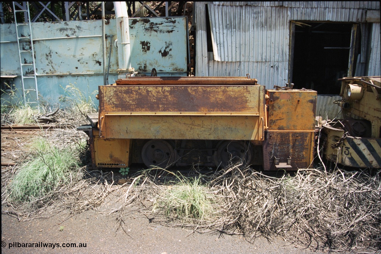 197-36
Wittenoom, Colonial Mine, asbestos mining remains, side view of throttle control box, battery box and wheel and brake arrangement of battery locomotive GEMCO Hauler serial 12304-05/10/65, motor H.P. 2/11, volts 80, drawbar pull (lbs.) 1250 built by George Moss Pty Ltd Leederville, WA.
Keywords: Gemco;George-Moss;12304-05/10/65;