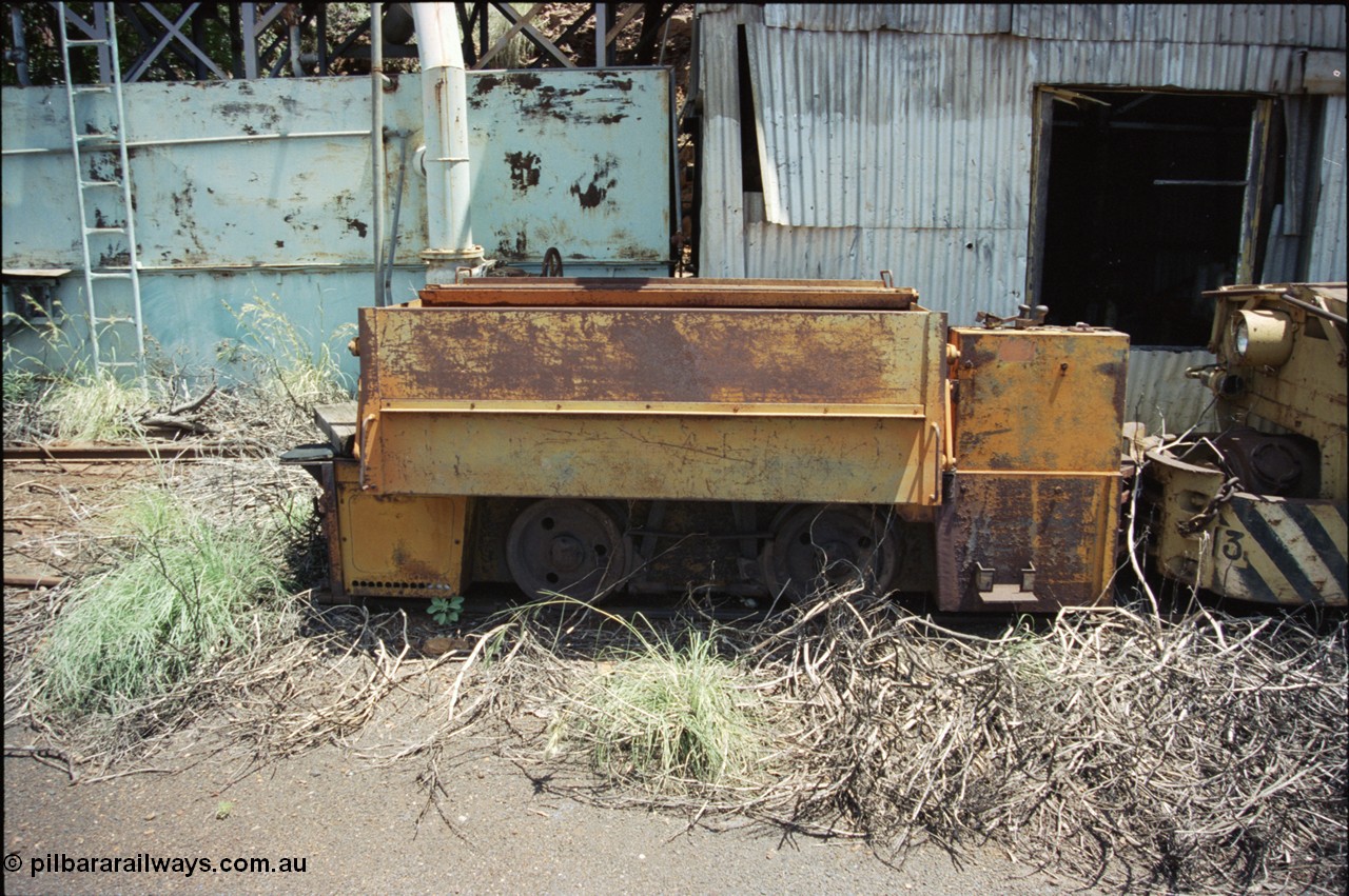 197-37
Wittenoom, Colonial Mine, asbestos mining remains, side view of throttle control box, battery box and wheel and brake arrangement of battery locomotive GEMCO Hauler serial 12304-05/10/65, motor H.P. 2/11, volts 80, drawbar pull (lbs.) 1250 built by George Moss Pty Ltd Leederville, WA.
Keywords: Gemco;George-Moss;12304-05/10/65;