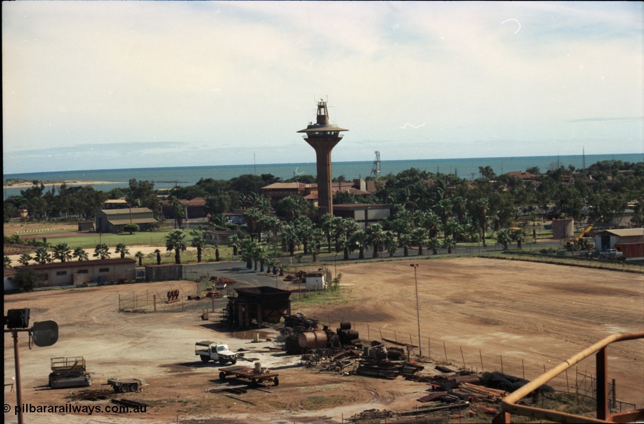 198-26
Port Hedland Port, view of Port Control Tower, grassed area with shed is for helicopter operator, the Esplanade Hotel can also be seen along with the lookout tower behind the visitors centre.
