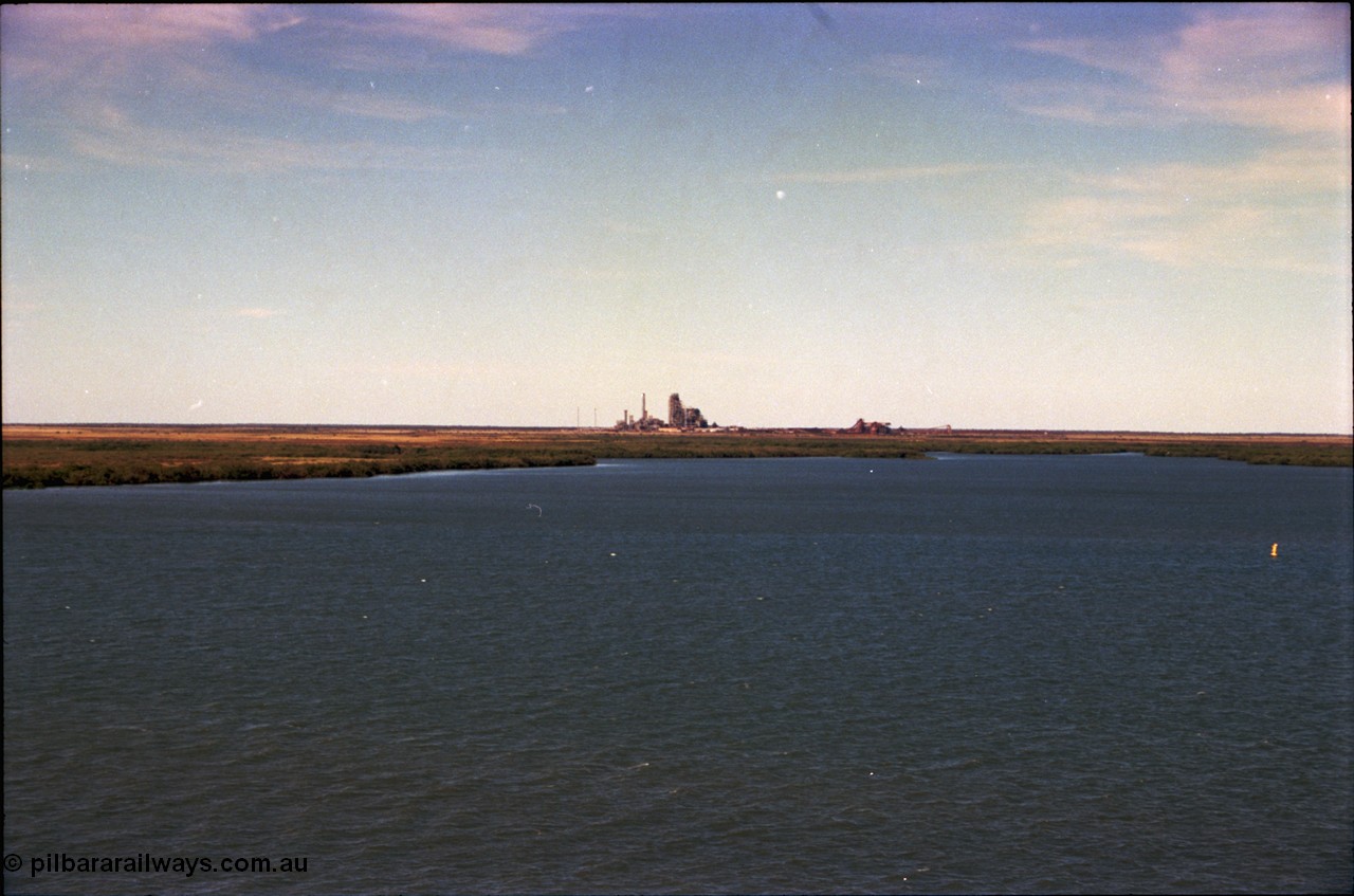 198-31
Port Hedland Port, view across harbour with now demolished HBI plant in the background, this plant was flattened in October 2011, this view is 2001, FMG have now built berths in this area and Roy Hill have a couple on the right.
