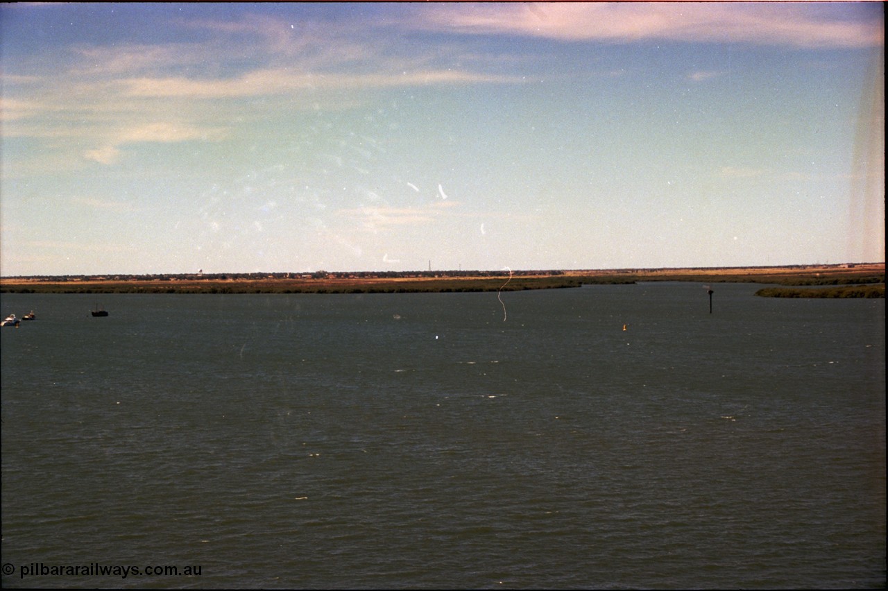 198-33
Port Hedland Port, view of ship turning basin with the South Hedland water tank in the distance, FMG now have a three berths in this location on the right. Early 2001.
