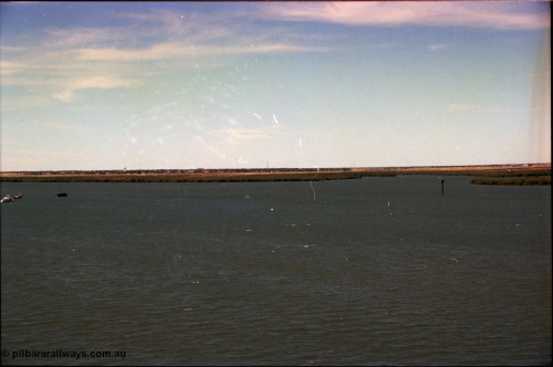198-33
Port Hedland Port, view of ship turning basin with the South Hedland water tank in the distance, FMG now have a three berths in this location on the right. Early 2001.

