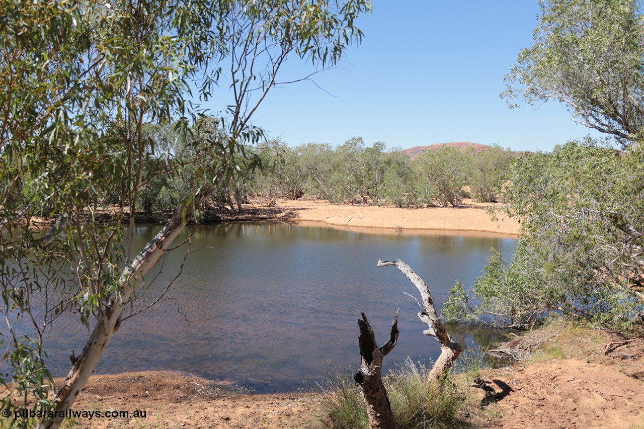 140517-4326
Eginbah Siding area, of the Marble Bar railway, former locomotive watering stop alongside the Talga River (closed in 1951), view of one of the pools water was drawn from, view looking north from the alignment over the river. [url=https://goo.gl/maps/kRCgSaoHC1m]Location here[/url].
