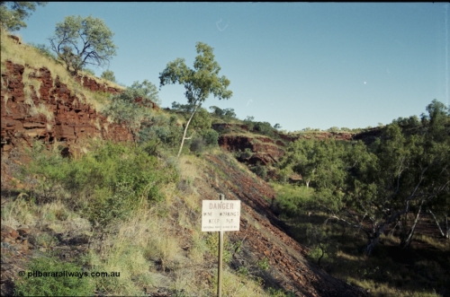 203-36
Yampire Gorge, remains of asbestos mining, former roadway over grown with sign from the National Parks Board of WA.
