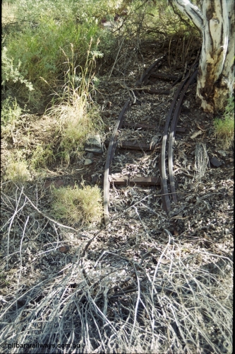 204-27
Wittenoom Gorge Mine, remains of asbestos mining, narrow gauge rail track section with extra inside rail to prevent derailments.

