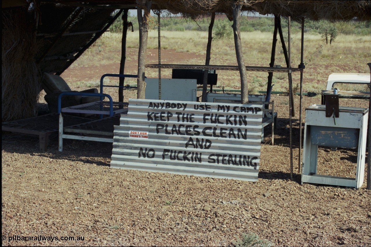 205-02
Roebourne - Wittenoom Road, Chichester Downs, camp located 4 km east of Rio Tinto railway, sign says it all.
