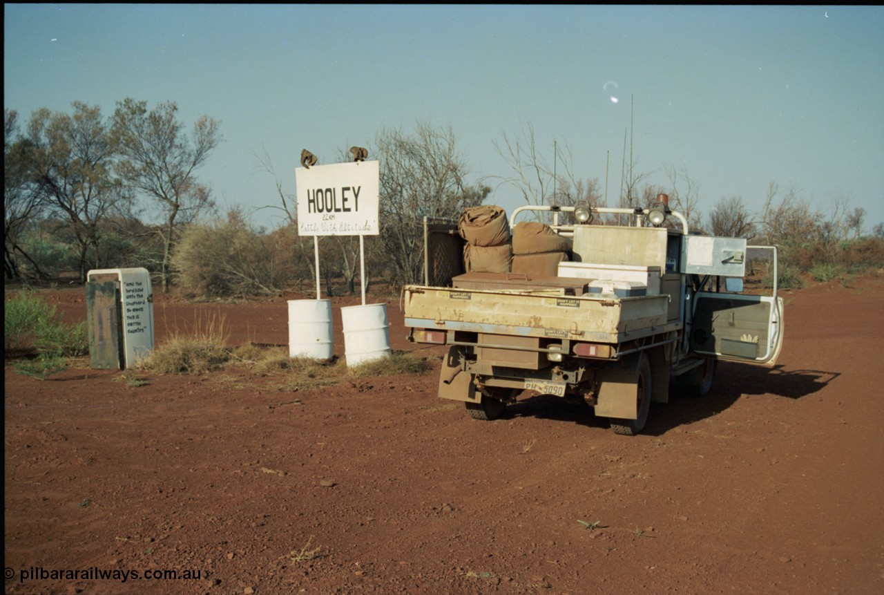 205-06
Hooley Station front gate, old refrigerator used for mailbox, 'and the lord said unto the Shepard go away this is cattle country', sign - , 'Cattle With Altitude'.
