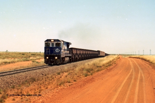 206-27
An empty train on the Yarrie (former Goldsworthy) line behind BHP 5633 'Hephaestus' built new in 1988 by Goninan as a GE CM39-8 model, serial 5831-12 / 88-082. The four CM39-8 units were upgraded to CM40-8 units following overhauls and finally scrapped in January 2016.
Keywords: 5633;Goninan;GE;CM39-8;5831-12/88-082;