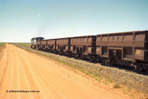206-31
An empty train on the Yarrie (former Goldsworthy) line behind BHP 5633 'Hephaestus' with a string of Golynx ore waggons, built by Goninan WA to a Lynx Engineering design, these are belly dump waggons as opposed to the BHP fleet of rotary dump bodies.
Keywords: 8419;Goninan-WA;Golynx;BHP-ore-waggon;