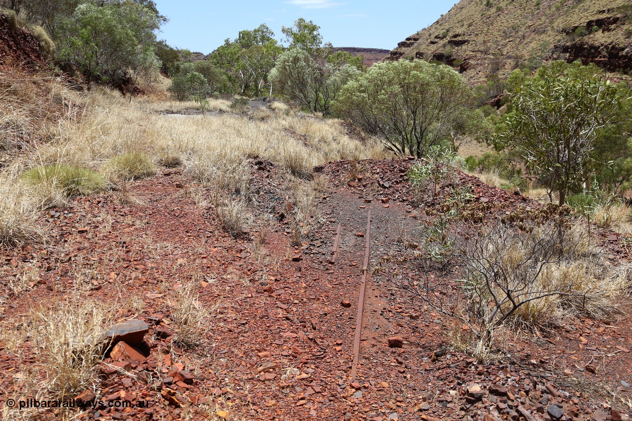 160101 9801
Wittenoom Gorge, Gorge Mine area, looking east along the north wall with the drive line to the adits, old rails embedded in track. [url=https://goo.gl/maps/W1kHXV2XJfyeVTWm6]GeoData[/url].
