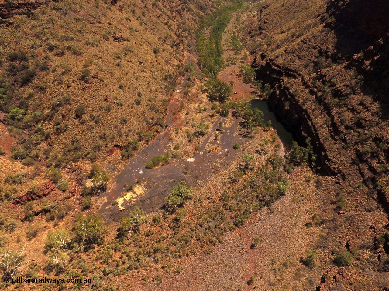 160101 DJI 0017
Wittenoom Gorge, view from above the Gorge Mine area and pool, looking north east, campers at pool, the drive can be seen cutting up the left side of the gorge, foot print of mine and building area clearly visible. [url=https://goo.gl/maps/tFzc7cw2fpB3MDRP9]Geodata[/url].
